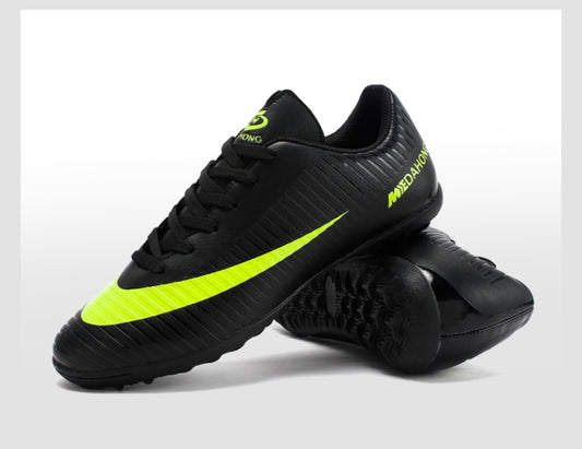 Black soccer training shoes with neon green side stripe and lace-up closure.
