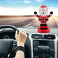 Santa Claus solar decoration with raised arms, red suit, and white beard on base