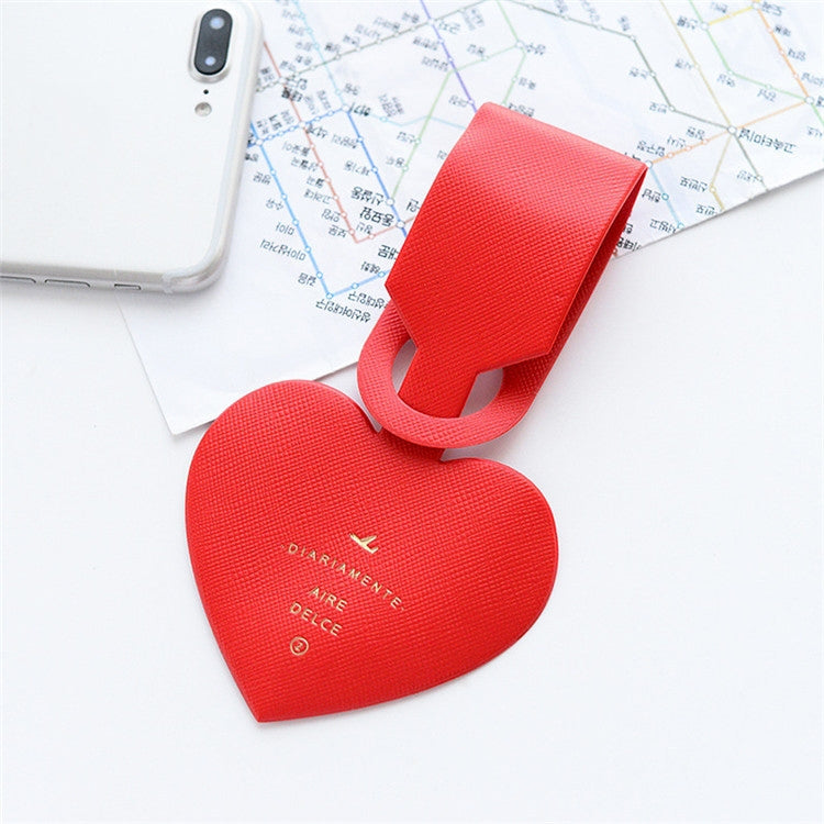 Red heart-shaped luggage tag with hanging loop and name card label area
