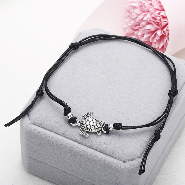 Black wax string anklet with sea turtle charm and small bead accents