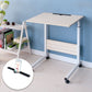 Removable laptop desk with light wood top, phone slot, storage shelf, and rolling casters