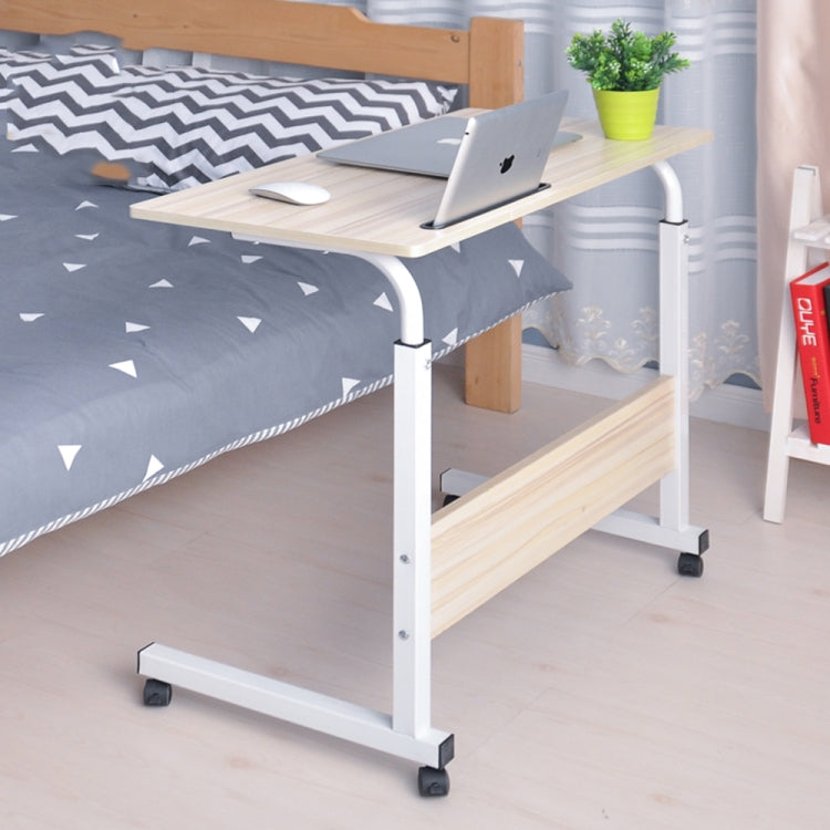 Bedside laptop desk with light wood top, storage shelf, phone slot, and rolling casters