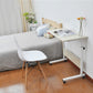 Bedside laptop desk with lift tabletop, white wood-look finish, on rolling casters