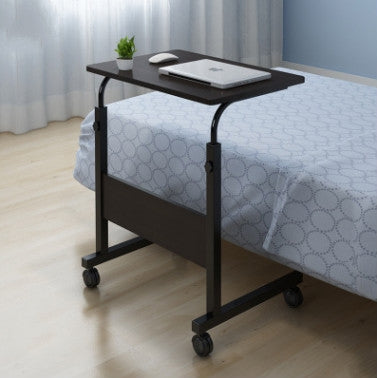 Bed desk with lift tabletop, black wood-look finish, rolling casters, for use on bed