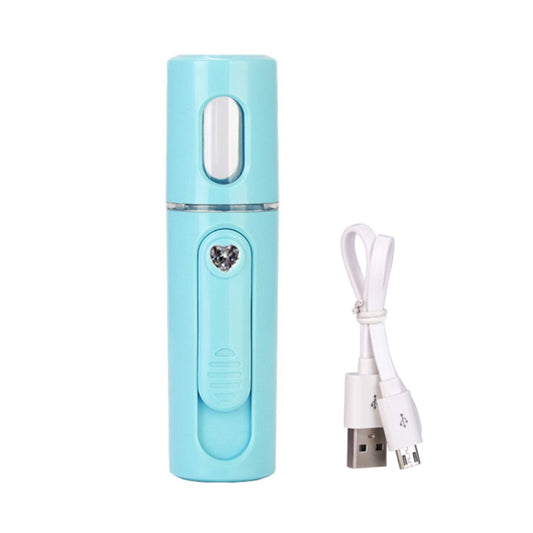 Light blue handheld facial nano steamer with open nozzle top and USB charging cable