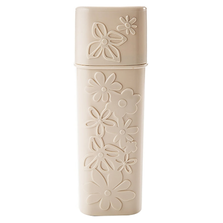 Beige carved travel toothbrush holder with flip-top cover and flower pattern