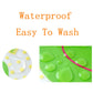Waterproof baby bib apron fabric shown with water droplets on green surface