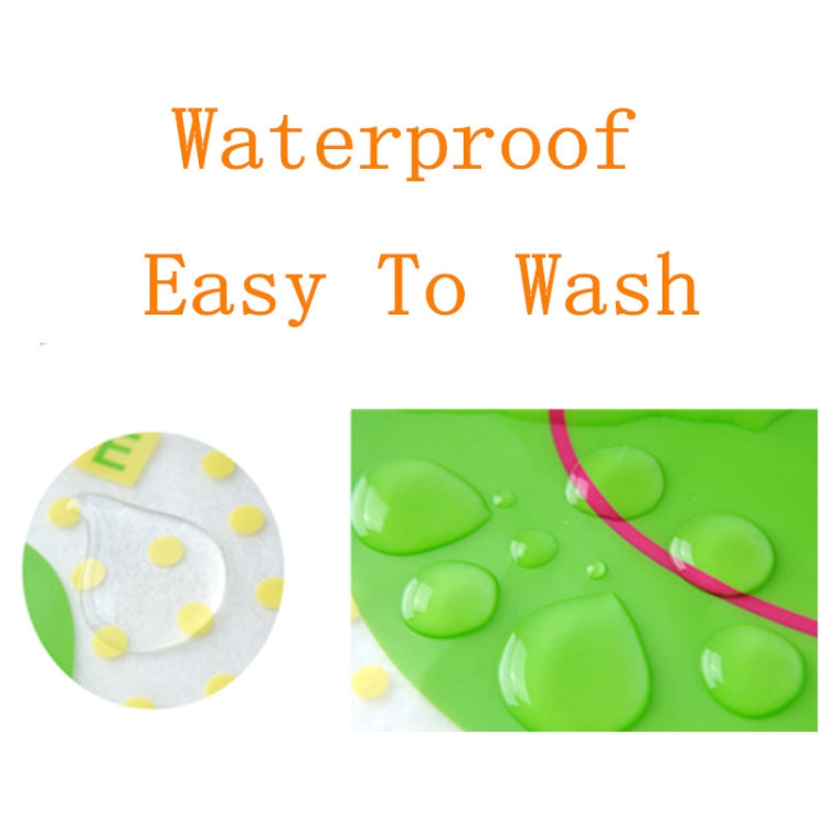 Waterproof baby bib apron fabric shown with water droplets on green surface