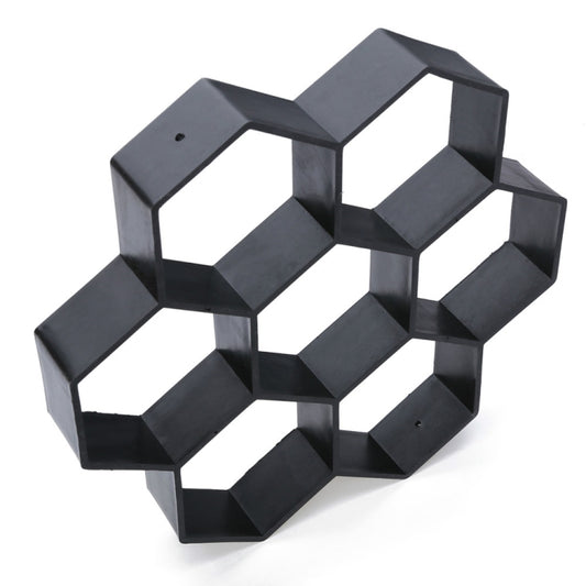 Hexagonal plastic paving mold with gray compartments and white hex openings in perspective
