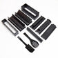 Assorted black sushi rice ball molds with rectangular inserts and utensils for shaping