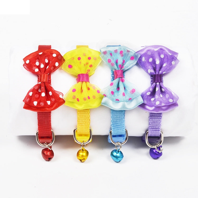 Adjustable pet bell collars with polka-dot bows in red, yellow, light blue, and purple
