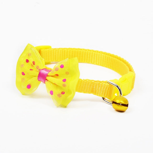 Adjustable pet bell collar with yellow bow and yellow collar and gold bell