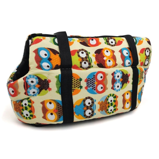 Pet carrying backpack with cream fabric and colorful owl print plus black shoulder straps