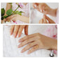 Rose gold open adjustable leaf-branch charm ring on a finger, shown being worn