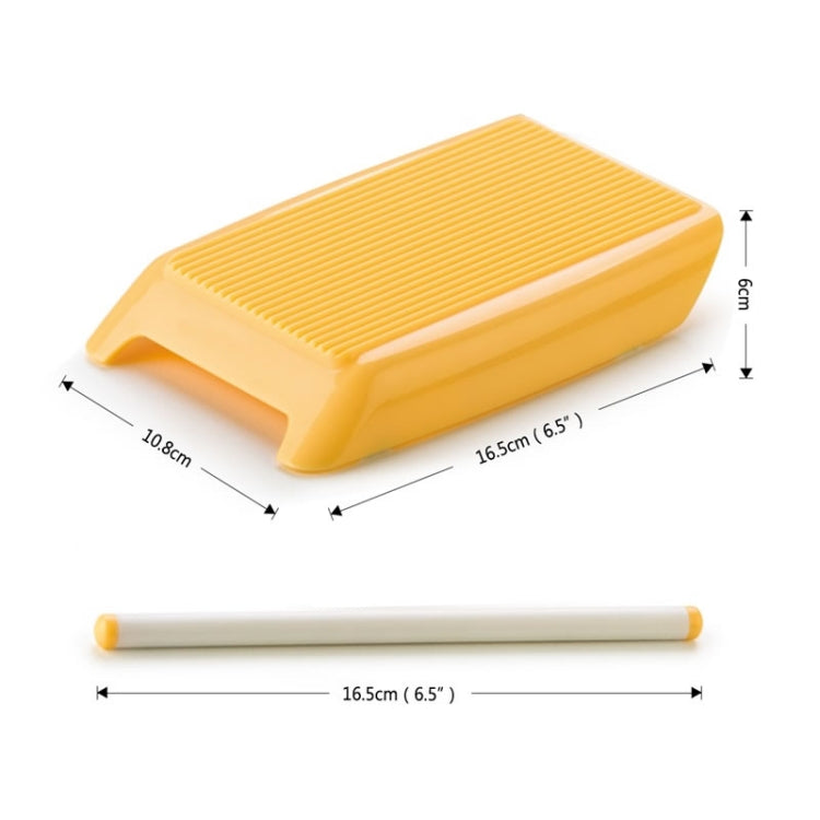 Yellow plastic spaghetti pasta maker with ridged mold tray and white rolling pin