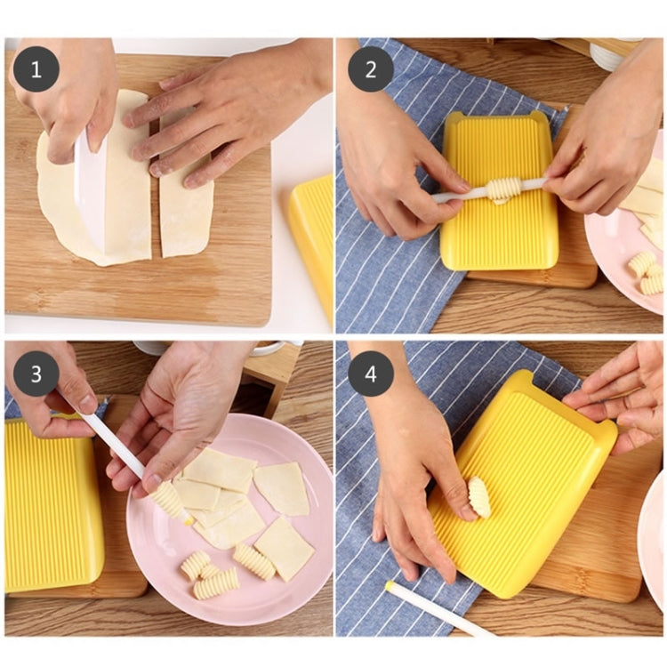 Yellow plastic ridged pasta mold with white roller, showing shaped macaroni pieces