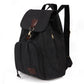 Black canvas backpack with flap pocket, zipper front, and adjustable shoulder strap