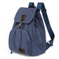 Blue canvas student laptop backpack with front flap pocket and adjustable shoulder strap