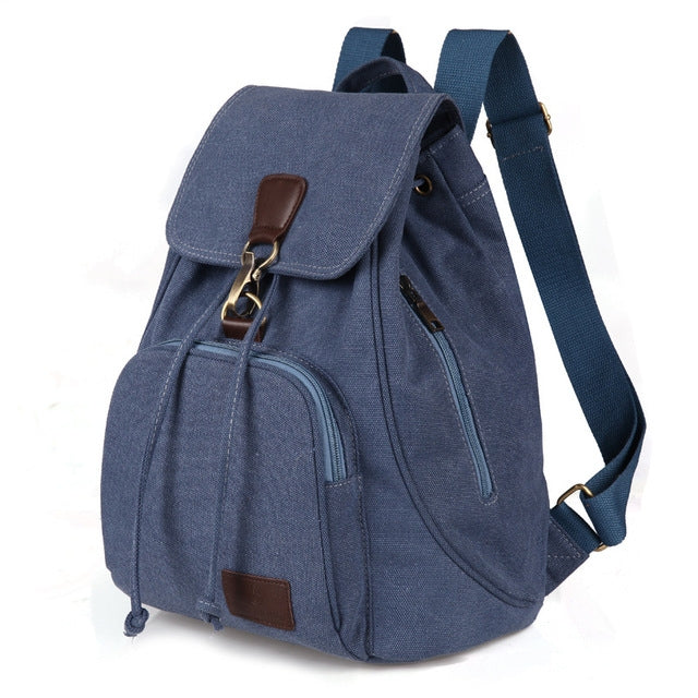 Blue canvas student laptop backpack with front flap pocket and adjustable shoulder strap