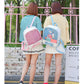 Kids’ mini transparent backpacks in pink and light blue with bow accents, worn from behind