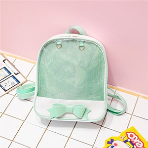 Mini transparent children's backpack in mint green with bow front detail and top handle