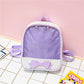 Mini transparent children's backpack in purple with bow front detail and top handle