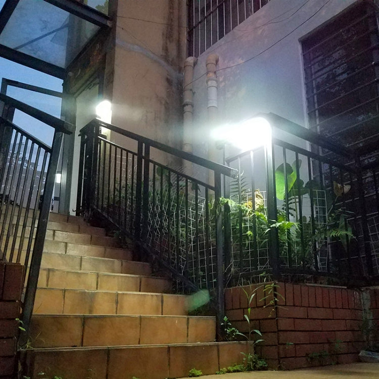 Outdoor solar wall light glowing from a mounted housing with motion sensor