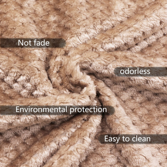 Beige faux-fur fleece blanket close-up with plush textured pile.