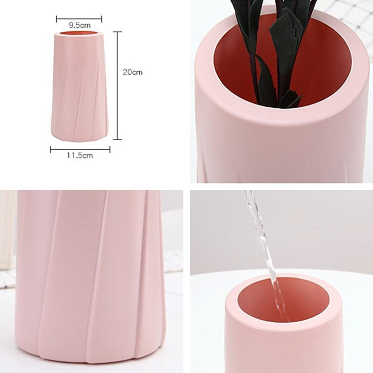 Pink plastic vase, 20cm tall and 9.5cm wide; fluted sides and round opening