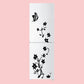 Black flower and vine refrigerator sticker with bird and blossoms on a two-door fridge.