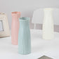 Set of ribbed plastic vases in pink, blue, and milk white, tall desktop flower holders