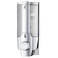 Wall-mounted manual soap dispenser, matte silver with clear refill tube and teal liquid