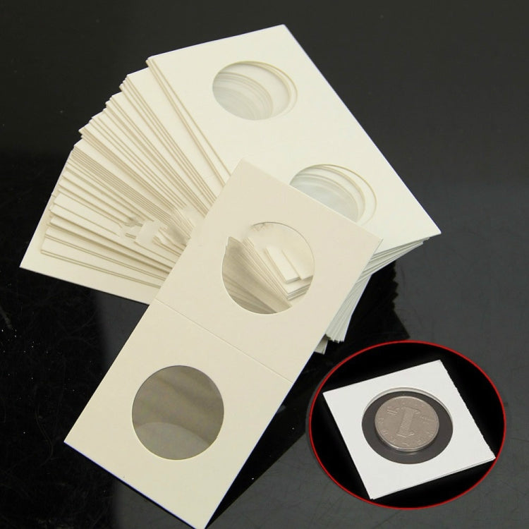 Coin protector cards with round openings, stacked with a small coin detail inset