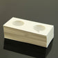 Stack of coin protector paper cards with round cutouts for coin display