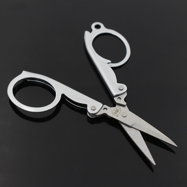Mini folding scissors with oval finger rings, stainless-steel look, pointed blades