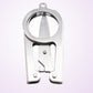 Mini folding scissors close-up of the blade hinge and spring mechanism, silver metal