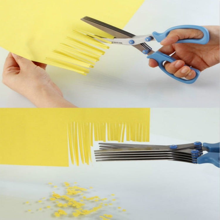 Blue kitchen herb scissor shredder with comb guard for chopping on a board