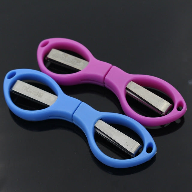 Foldable mini scissors set with blue and purple handles, stainless blades visible