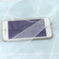Transparent mesh pocket on white mosquito net for storing a phone