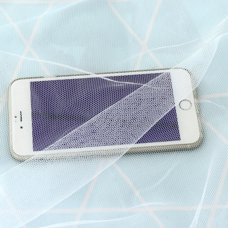 Transparent mesh pocket on white mosquito net for storing a phone