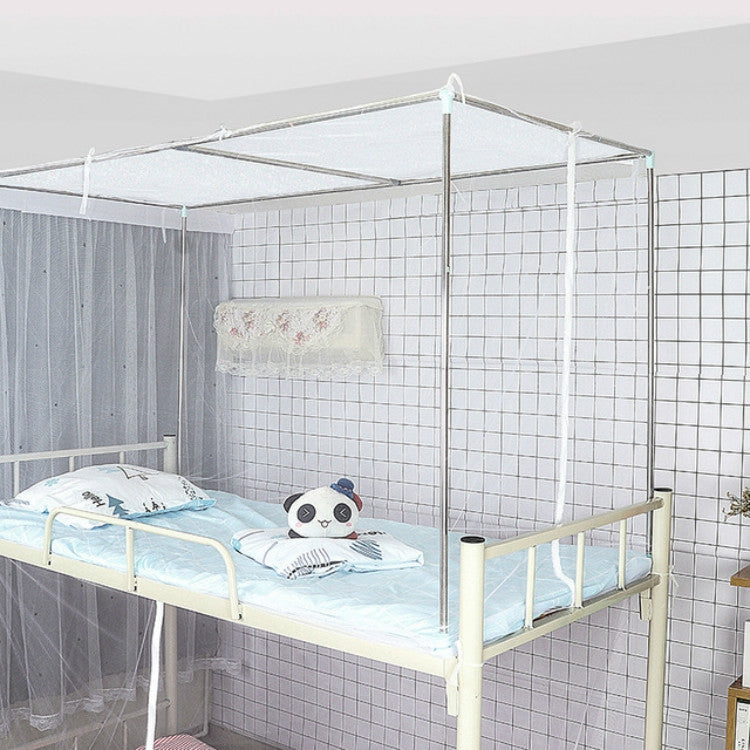 White upper bunk mosquito net enclosure over single bed with front rail frame