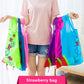 Reusable folding shopping bags in green, pink, purple, and blue with flower appliques