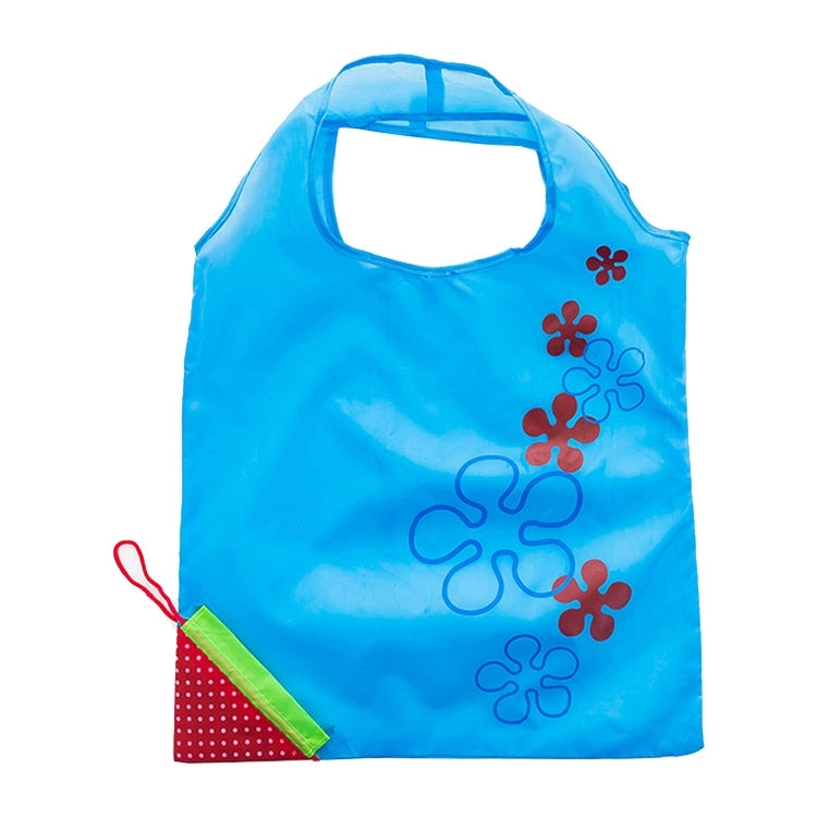 Light blue reusable folding grocery shopping bag with flower appliques and green-trim pocket