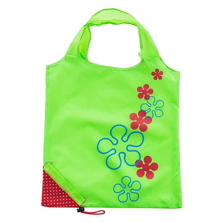 Reusable folding grocery bag in bright green with colorful flower print and corner pocket