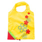 Reusable folding grocery bag in yellow with colorful flower print and corner pocket