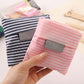 Foldable shopping bag, pink and white striped, pocket label detail shown on front