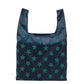 Foldable shopping bag, dark navy with green star pattern, open tote with U handles
