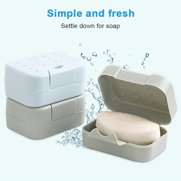 Stacked portable soap boxes, white and cream tones with drainage hole pattern