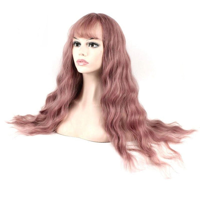 Women's long curly wig, side-swept bangs and flowing dusty rose pink waves