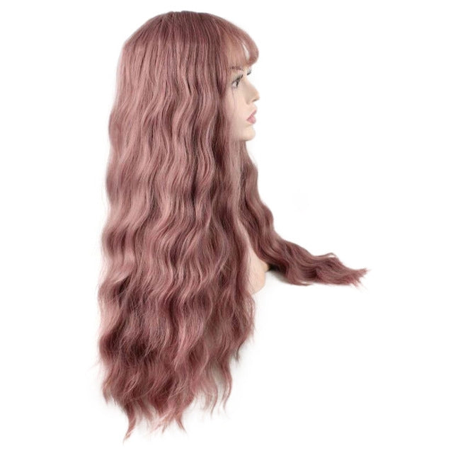 Women's long curly wig, side view with layered dusty rose pink waves